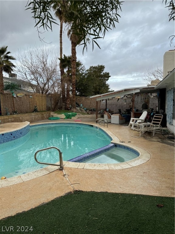 view of swimming pool featuring a patio