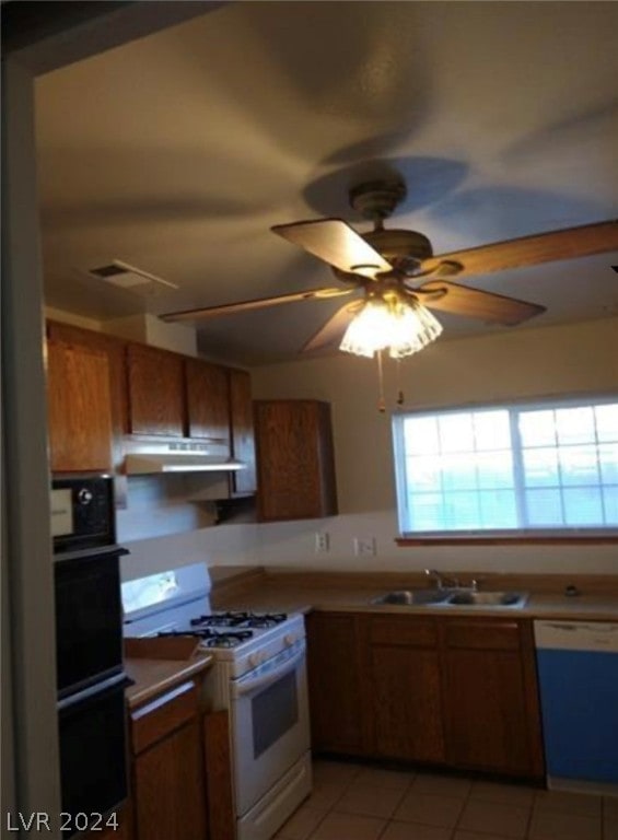 kitchen with ceiling fan, sink, gas range gas stove, dishwasher, and double wall oven