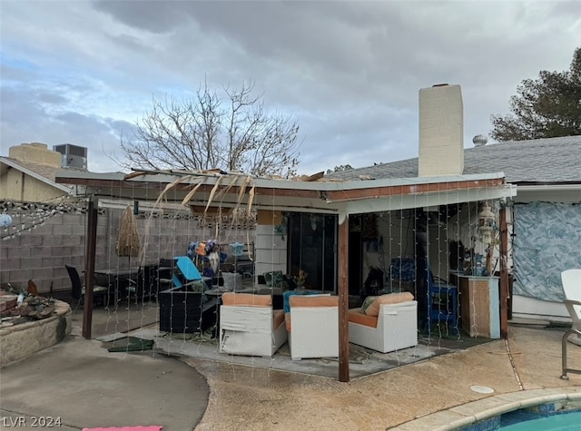 rear view of property featuring a patio