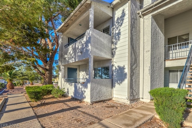 view of home's exterior with a balcony