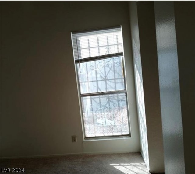 empty room with light colored carpet