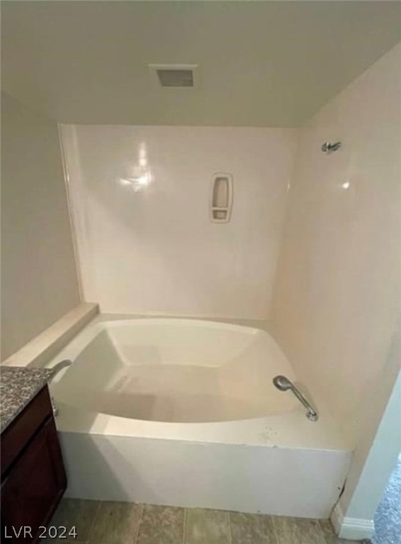 bathroom featuring vanity and tile flooring