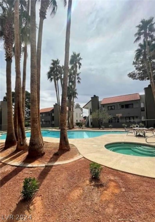 view of swimming pool featuring a patio