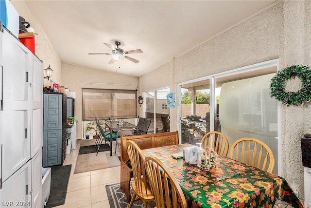 dining space featuring ceiling fan and light tile patterned floors