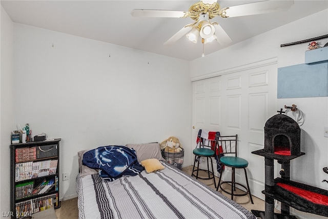 bedroom featuring a ceiling fan, a closet, and carpet flooring