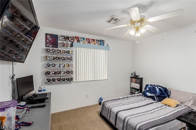 bedroom with carpet, visible vents, ceiling fan, and baseboards