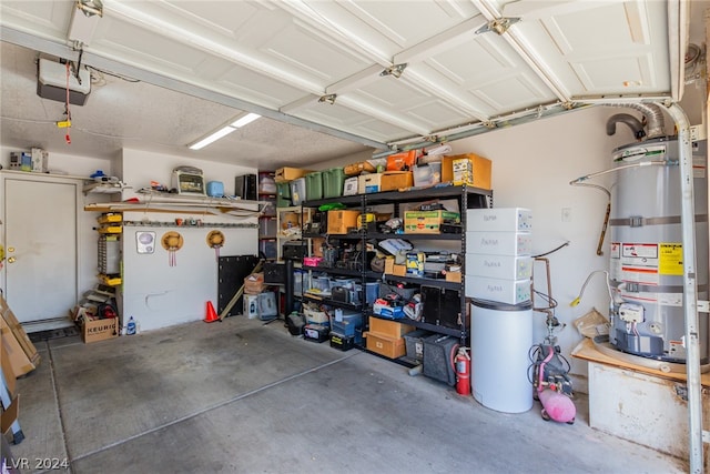 garage with a garage door opener and water heater