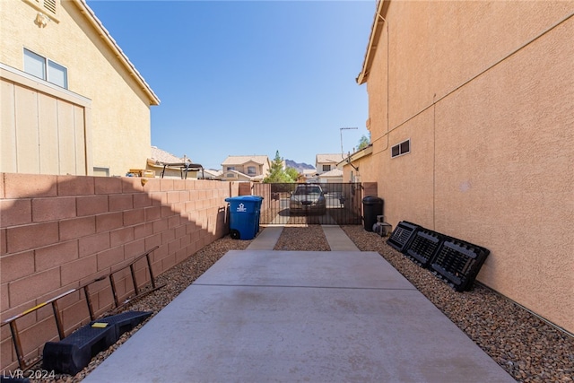 view of patio with a fenced backyard and a gate