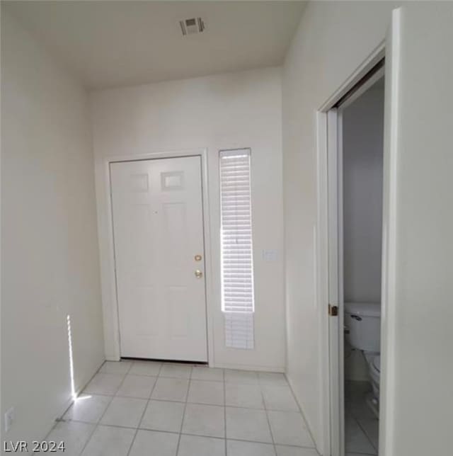 foyer featuring light tile flooring