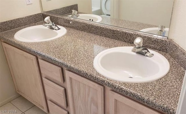 bathroom featuring double sink vanity and tile floors