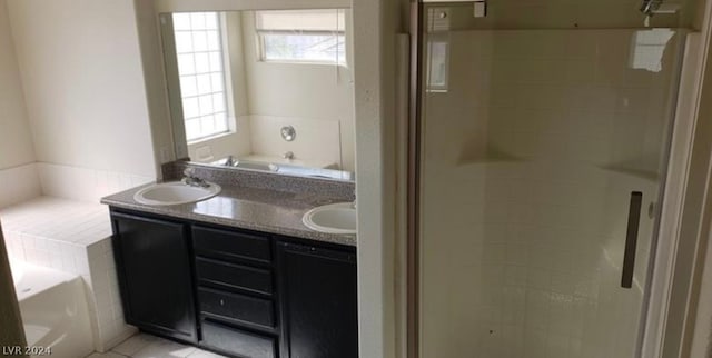 bathroom featuring tile flooring, plus walk in shower, and dual bowl vanity