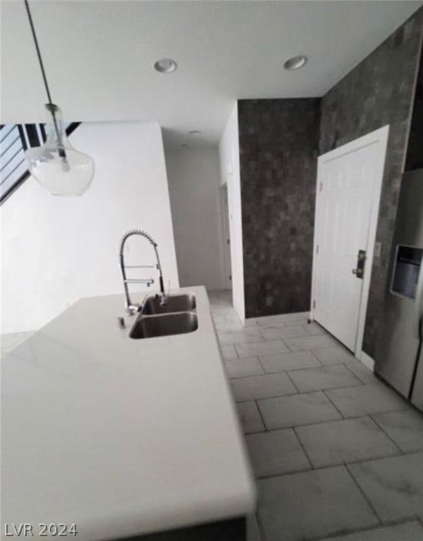 bathroom with tile floors and sink