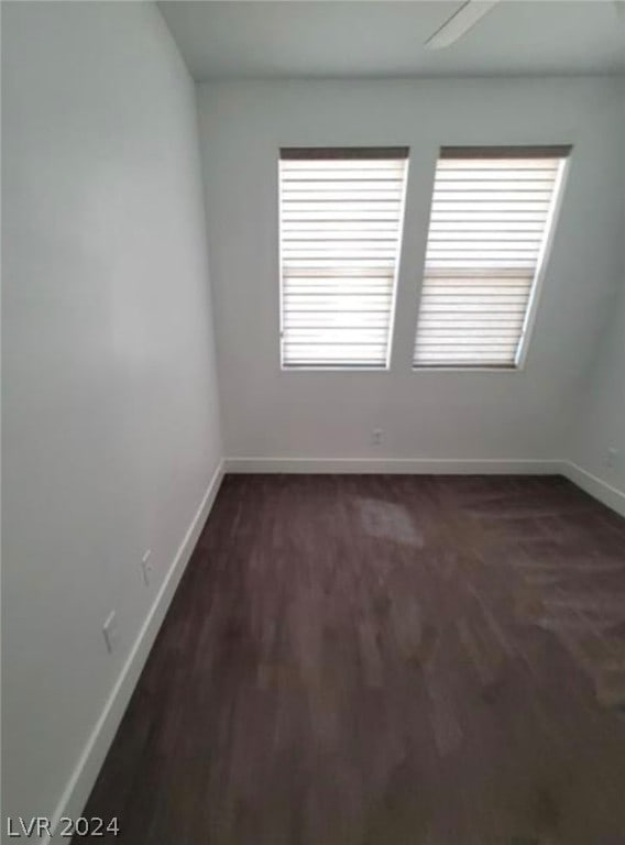 spare room with dark hardwood / wood-style floors