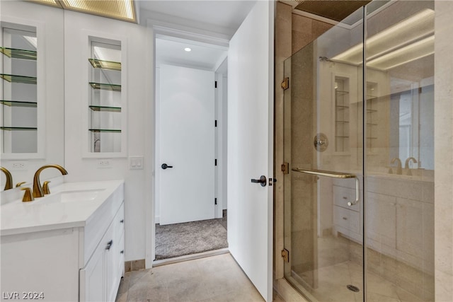 bathroom featuring vanity and a shower with shower door