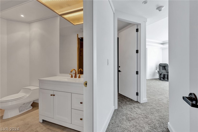 bathroom featuring vanity and toilet