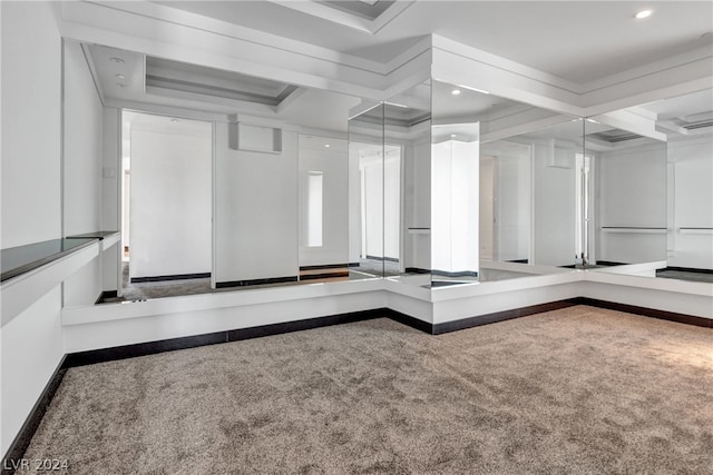 interior space featuring coffered ceiling, carpet flooring, and beamed ceiling