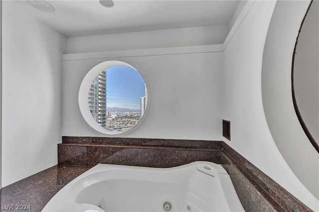 bathroom featuring a washtub