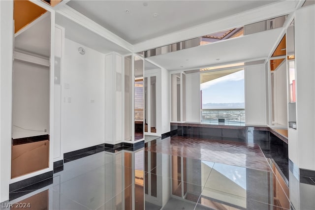 bathroom featuring ornamental molding and tile patterned flooring