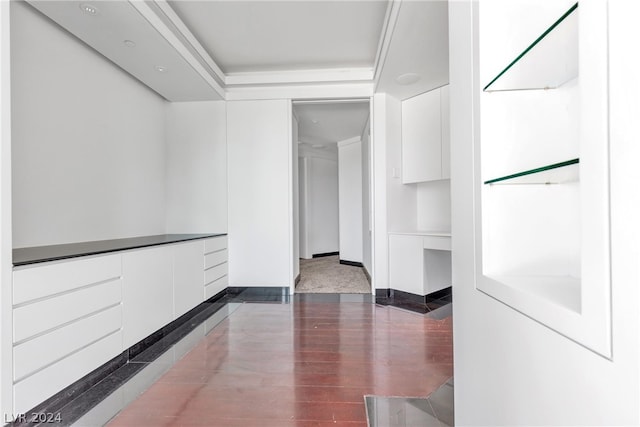 hallway with hardwood / wood-style floors