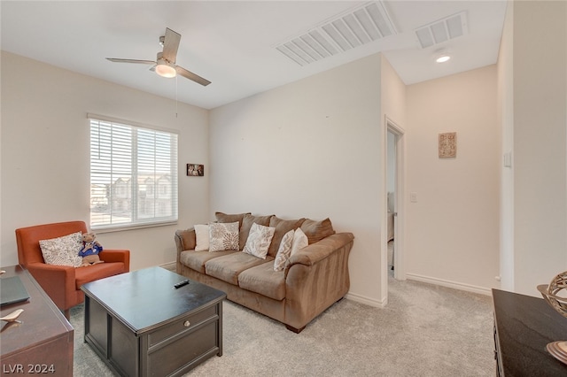 carpeted living room featuring ceiling fan