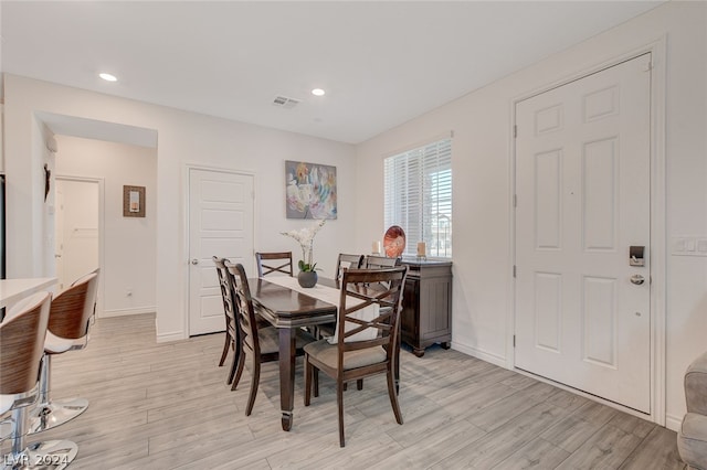 dining area with light hardwood / wood-style flooring