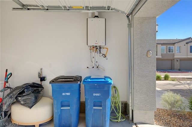 room details featuring concrete floors and water heater