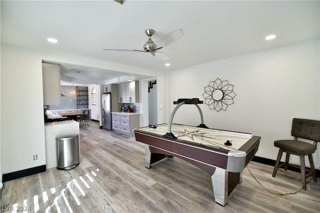 recreation room featuring billiards, ceiling fan, and light wood-type flooring