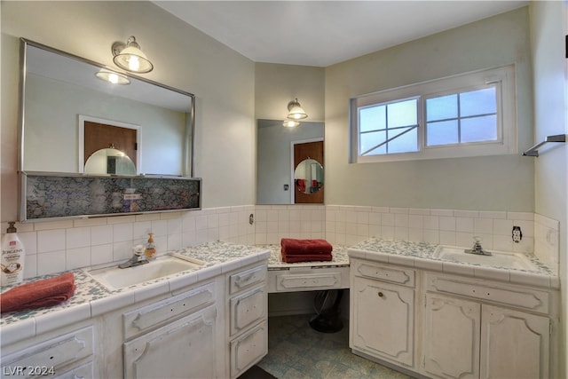 bathroom with tile flooring, backsplash, and vanity