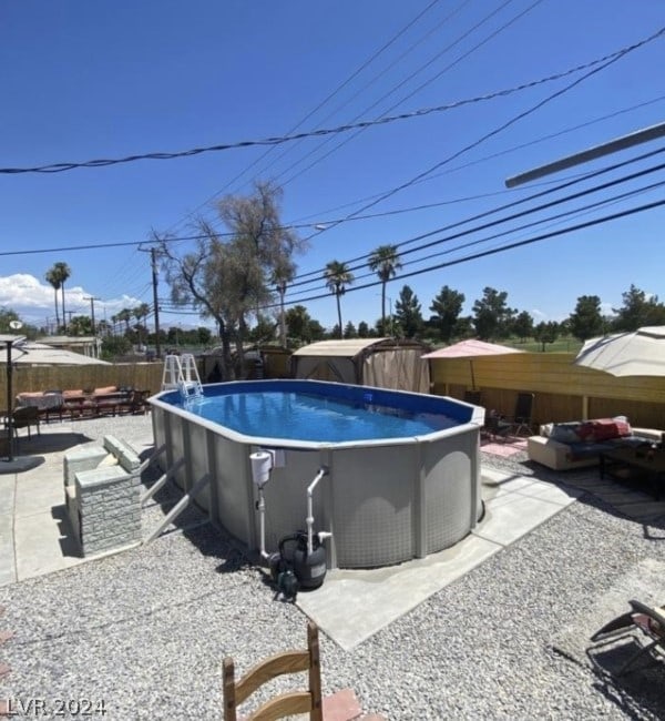 view of pool featuring a patio