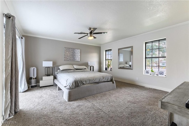 carpeted bedroom with ceiling fan, crown molding, and a textured ceiling