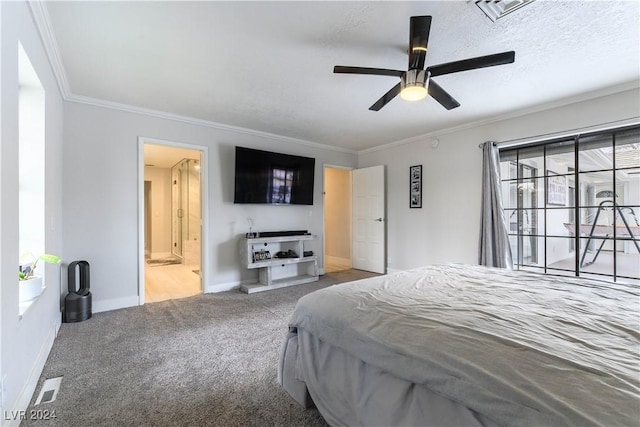 carpeted bedroom featuring ornamental molding, connected bathroom, and a textured ceiling