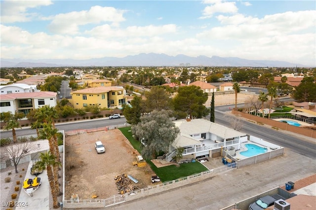 birds eye view of property featuring a mountain view