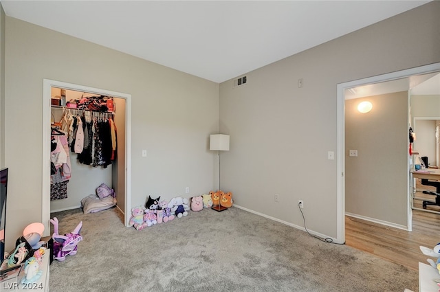 carpeted bedroom featuring a closet