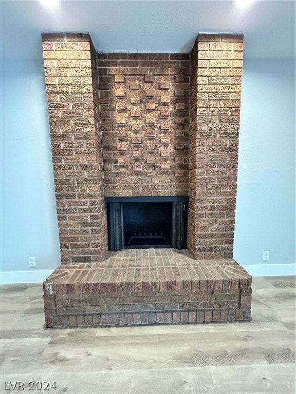 details featuring a brick fireplace