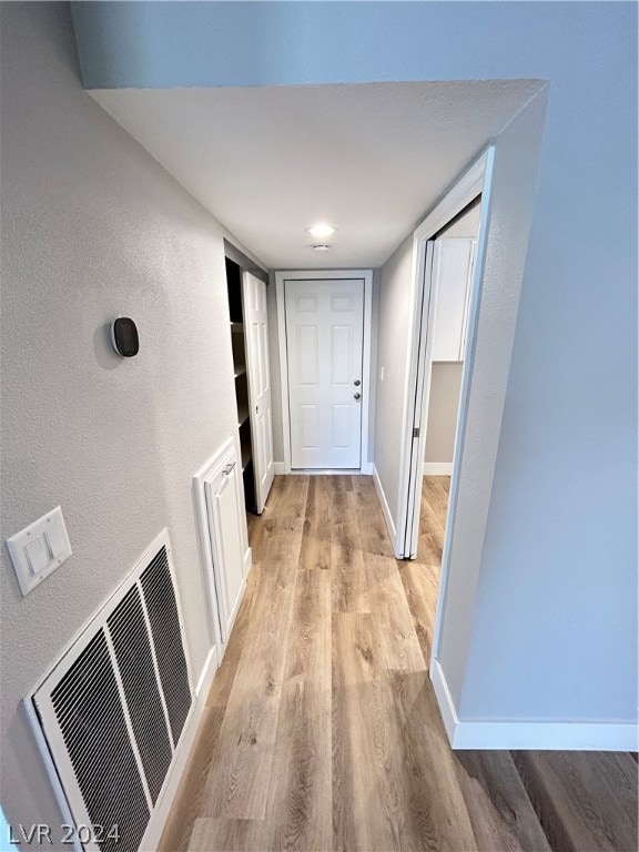 hallway featuring light wood-type flooring