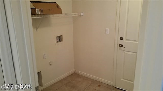 laundry room featuring hookup for a washing machine and light tile floors