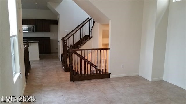 stairs with light tile flooring