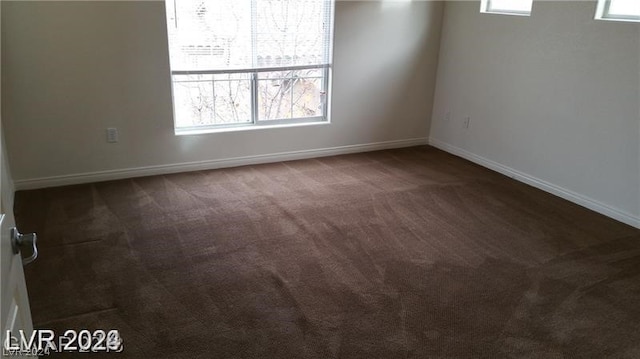 carpeted empty room featuring a healthy amount of sunlight