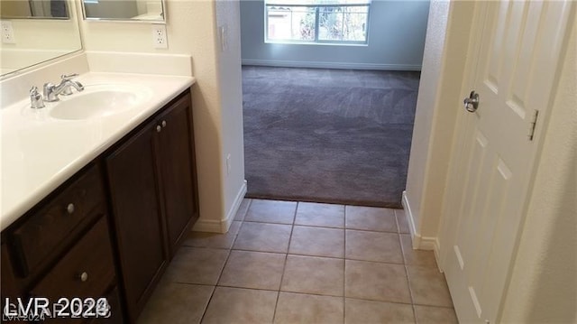 bathroom with tile floors and vanity