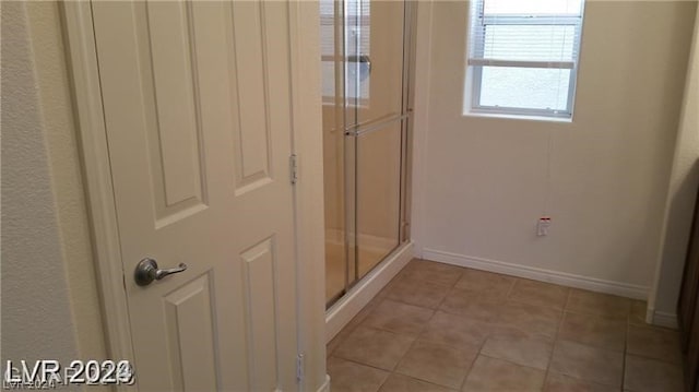 bathroom with tile flooring