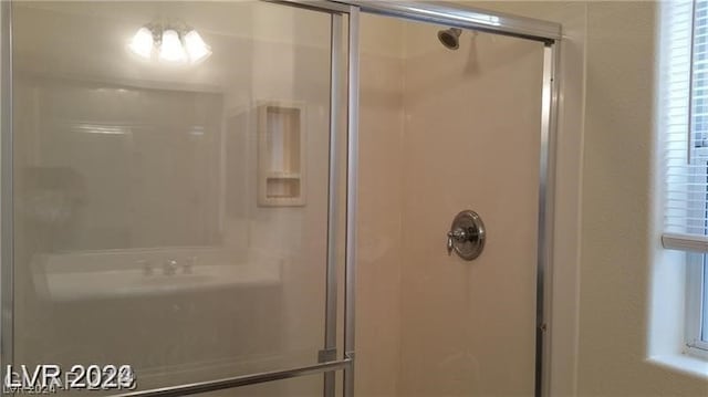 bathroom featuring an enclosed shower