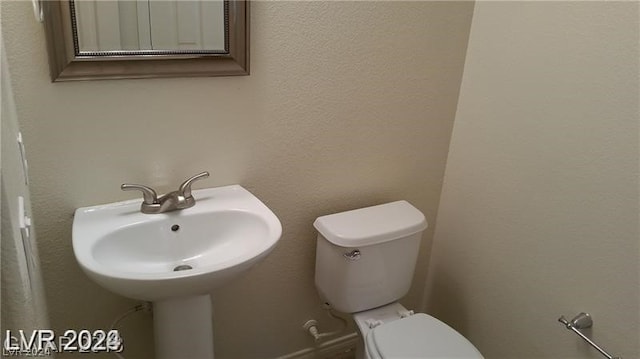 bathroom featuring toilet