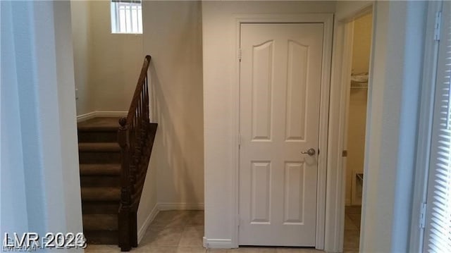 stairs featuring light tile floors