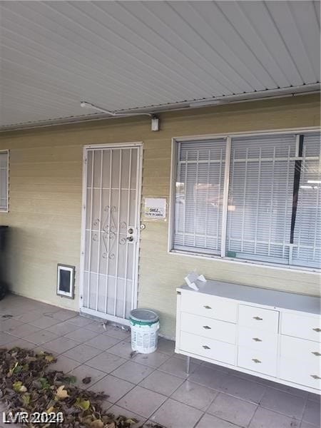 entrance to property with a patio area