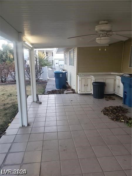 view of terrace featuring ceiling fan