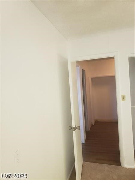 corridor featuring hardwood / wood-style flooring