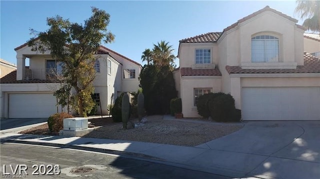 view of front of home featuring a balcony and a garage