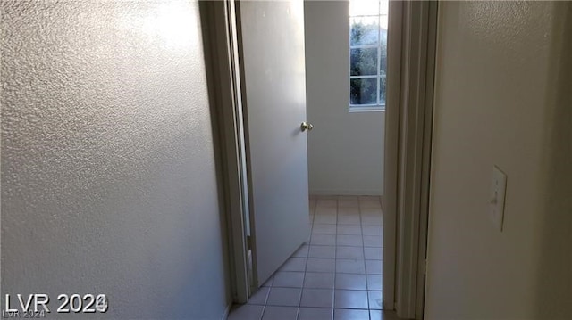 corridor with light tile flooring