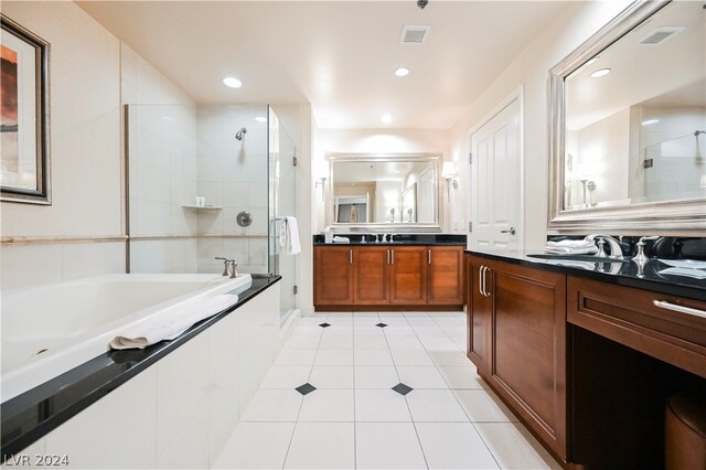 bathroom with tile flooring and double vanity