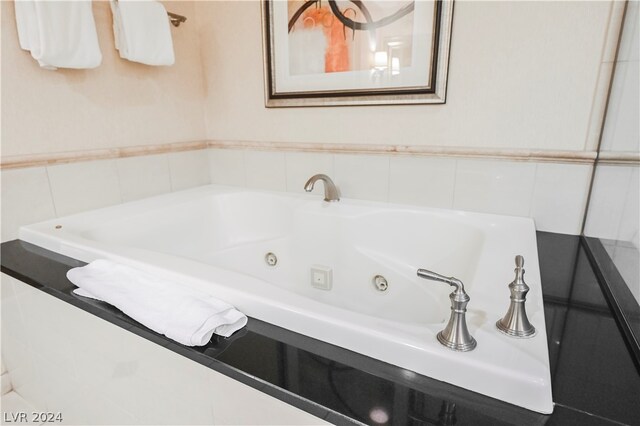 bathroom featuring tile walls